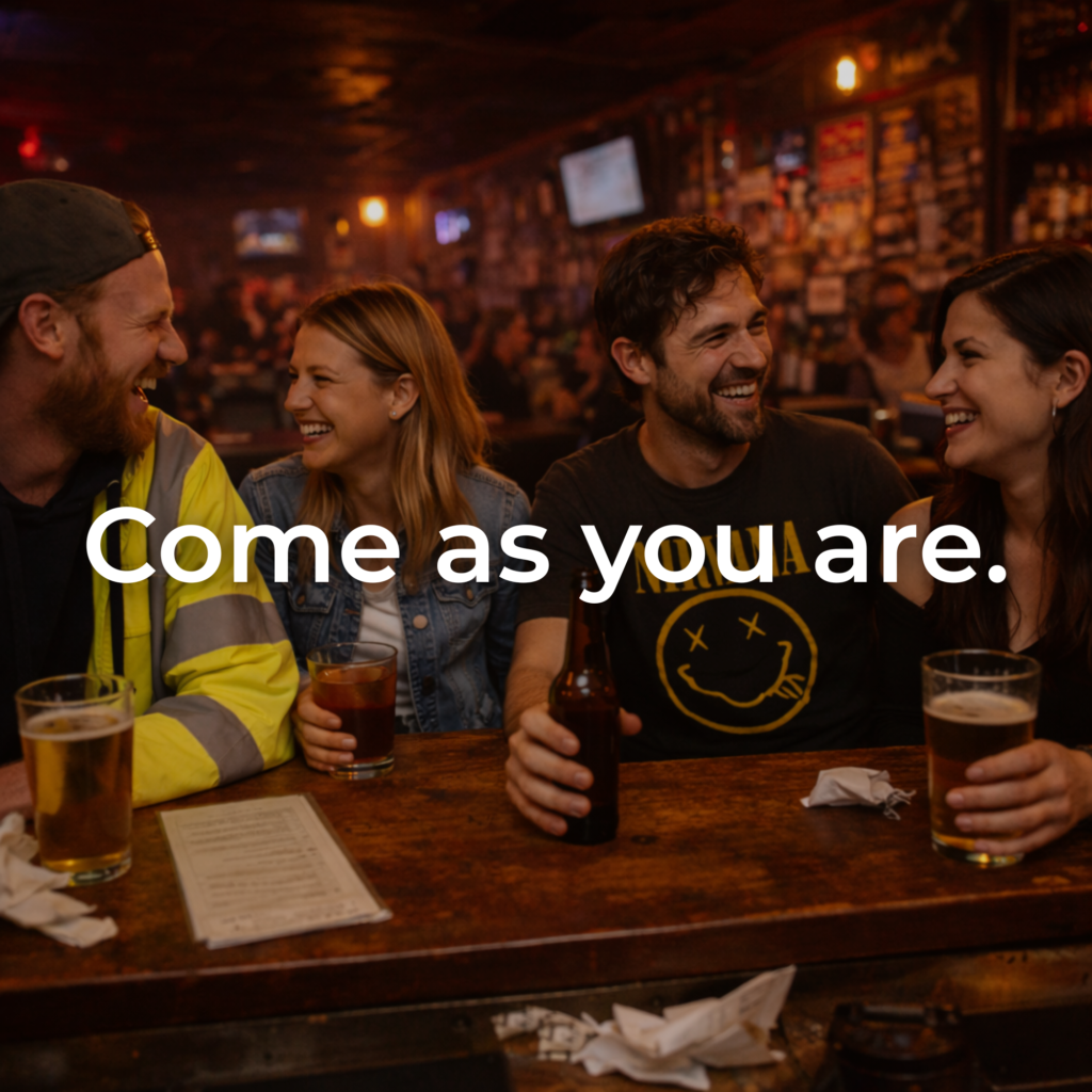 Friends enjoying drinks and conversation at a Garden City dive bar, showing the relaxed, come-as-you-are atmosphere at Rockstarz.