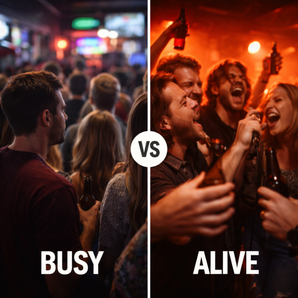 Stage monitor speaker at Rockstarz in Garden City with a lively karaoke crowd under red lights, capturing the pulse of the room.